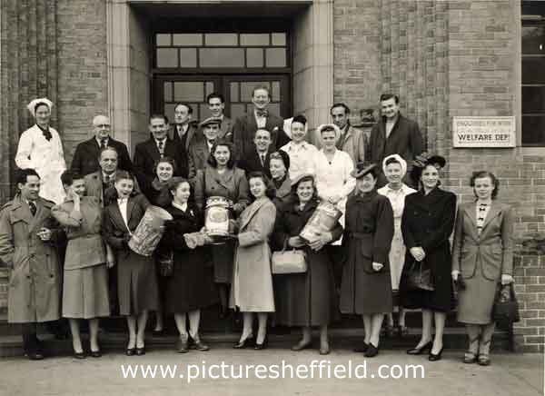 Group of employees from Batchelor Peas Ltd., Underhill Lane showing Maurice Wilkinson (centre of middle row and left of lady in white overalls)