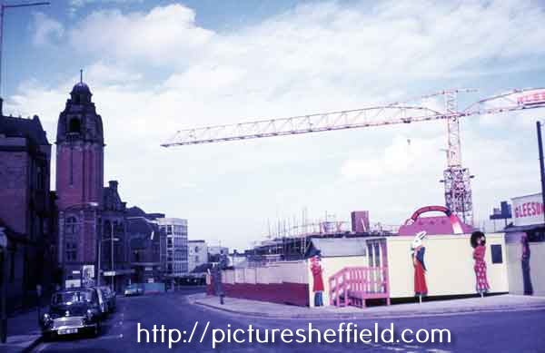 Norfolk Street showing (right) the construction of the Crucible Theatre and (left) Victoria Hall