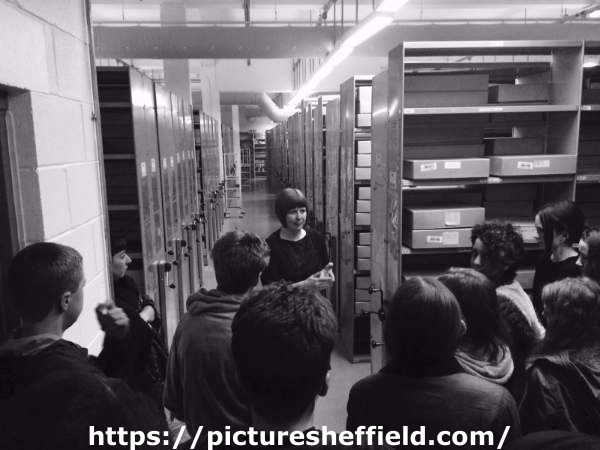 Cheryl Bailey (centre facing), senior archivist, with a group of students visiting Sheffield Archives