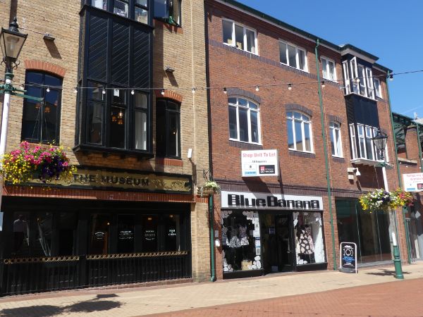 Museum public house, No. 25 and Blue Banana body piercing shop, No. 19 Orchard Square, Orchard Square Shopping Centre