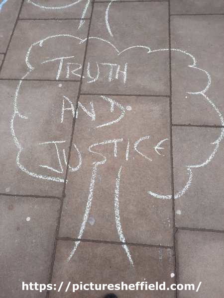 Message on the pavement at a demonstration outside Sheffield Town Hall following the publication of a report by Sir Mark Lowcock into the street trees dispute