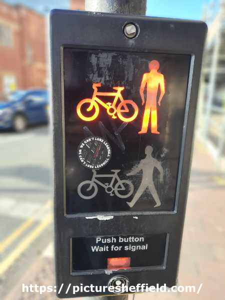 We can't lose Leadmill sticker on a pedestrian crossing control panel