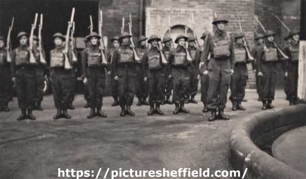 Group of Sheffield Home Guard members stood to attention, [c. 1940]