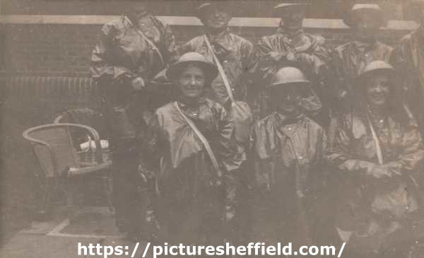 Sheffield ARP Ambulance Service officers, wearing gas protection coats, at Hartley Brook School Depot, Sheffield