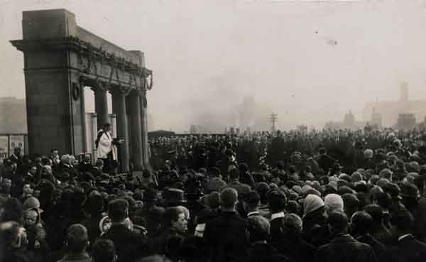 Rev. Frank Yates holding a war memorial service [?at the Midland Station]