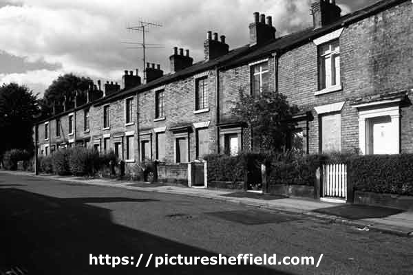 Row of boarded up terraced houses behind Ecclesall Road