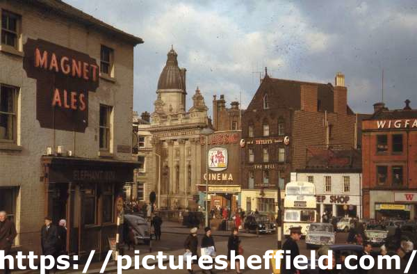 Junction of Norfolk Street looking towards Fitzalan Square showing (left) The Elephant Inn, Nos 2- 4 Norfolk Street, (centre) The Jolson Story playing at the Classic Cinema and (right) Wigfalls, electrical store