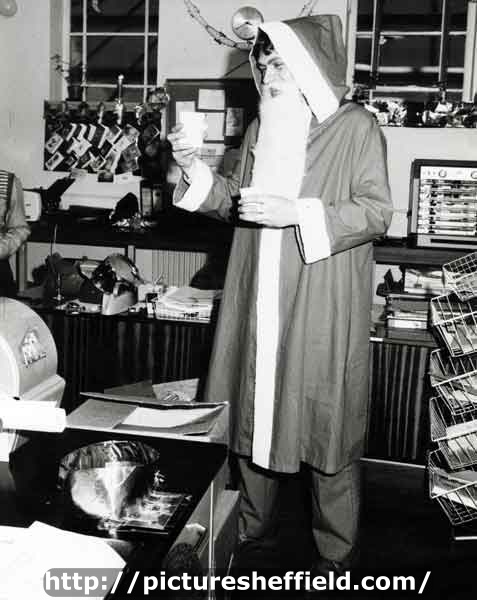 Keith Crawshaw, librarian, as Father Christmas in the Central Library, Surrey Street