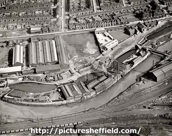 Aerial view of Sheffield and SYK Navigation showing the River Don; W.T. Flather Ltd., Standard Steel Works with Sheffield Road and Dundas Road running parallel and Raby Street at right angles