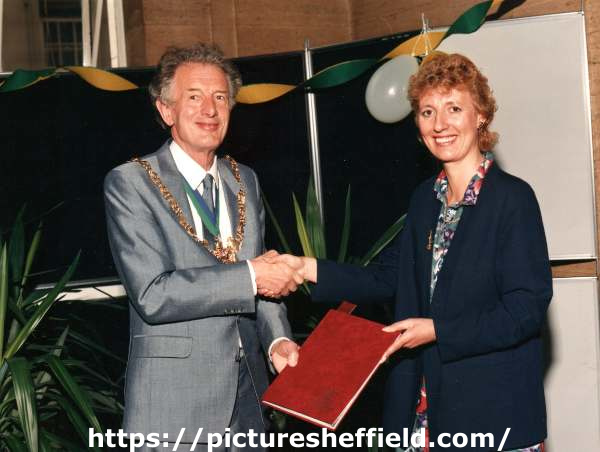 Presentation of Sheffield Handbook to (left) Lord Mayor, Peter Horton from Chief Publicity Officer, Shirley Canstone, c.1987