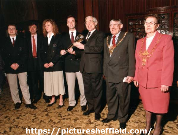 Handing over of the Torch for the World Student Games in Sheffield showing (2nd right) the Lord Mayor, Councillor James Moore and (1st right) Lady Mayoress, Mrs Sheila Moore
