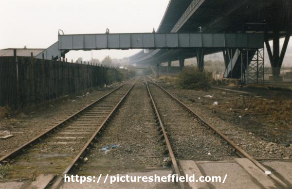 South Yorkshire Transport Executive (SYPTE). Rail tracks and footbridge alongside the Tinsley Viaduct