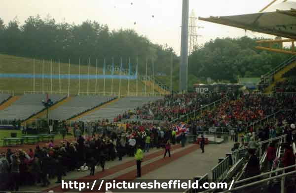 Spectators at the start of the Olympics 2012 torch procession at Don Valley Stadium