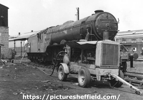 Work being undertaken on a steam locomotive, possibly by Darnall Shotblasting Co. Ltd.