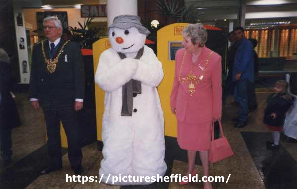 Councillor Frank White, Lord Mayor and Mrs Freda White, Lady Mayoress meet the children's book character the Snowman at the 'Read Me' campaign at Meadowhall Shopping Centre, c.1997 -1998