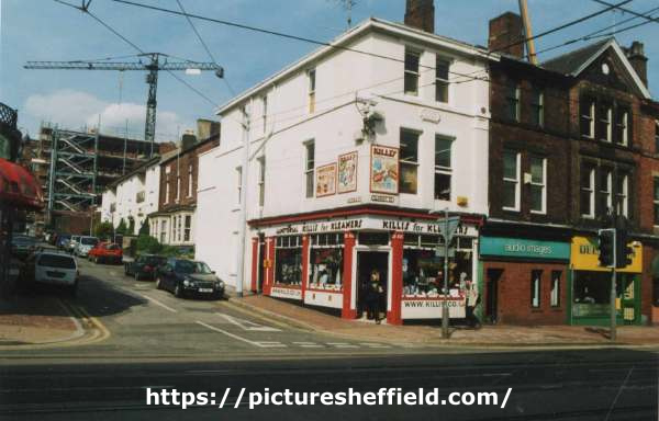 Shops on Glossop Road showing (l. to r.) No. 286 Killies for Kleaners, domestic and commercial vacuum cleaners and No. 284 Audio Images Ltd., at the junction with (left) Victoria Street