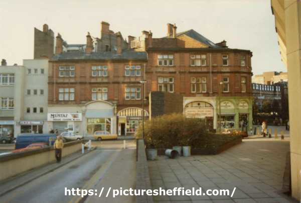 Norfolk Street from Town Hall extension showing (l. to r.) Nos. 188/90 G.M.B.Union offices; 186 Mumtaz restaurant; 184, Beds Galore; 178 Vernons, bakers; 176 Hearing Aid Services; 174 Sheffield Health Food Store and 172 Army and General Stores Ltd.