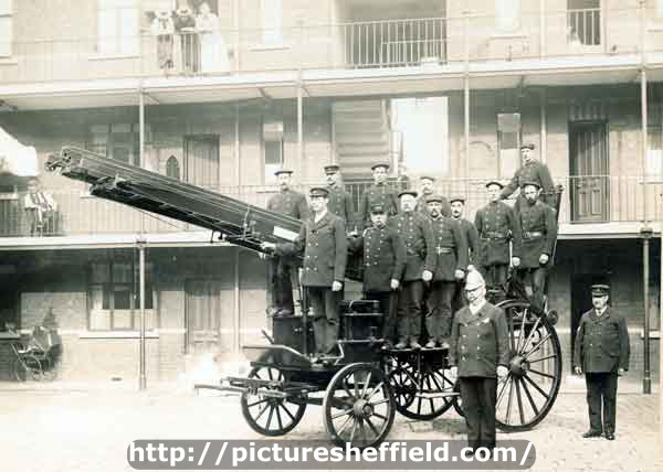 Group of firemen including Superintendant William Frost with a horse drawn fire engine outside Rockingham Street Fire Station showing (back) Firemans flats