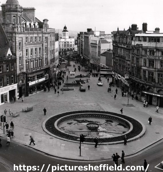 Fargate looking towards High Street showing (bottom) the Goodwin Fountain and (right) Yorkshire Bank Ltd