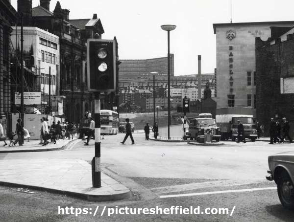 Junction of (foreground) High Street and Commercial Street showing (left) construction work on Yorkshire Bank building, (centre back) Park Hill flats and (right) Barclays Bank