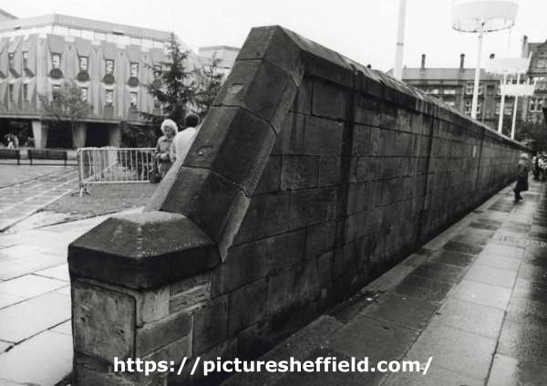 Wall to rear of bus stops on Pinstone Street showing (left) Peace Gardens and Town Hall Extension (also known as the Egg Box (Eggbox))