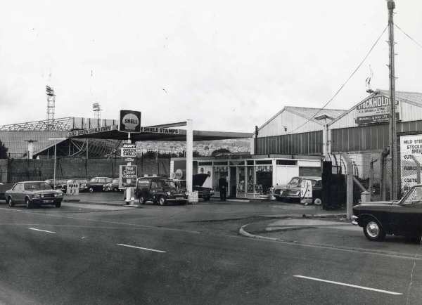 Petrol station on Herries Road South showing (right) A. A. Bramall Ltd., non ferrous metal merchants, Grandstand Works and (top left) Hillsborough football ground