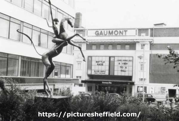 Horse and Rider sculpture by David Wynne, Fountain Precinct, Barkers Pool showing (centre) the Gaumont 2 Cinema and (left) New Oxford House offices, Barkers Pool