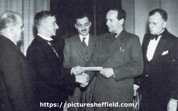 Russian attache being presented with a cheque from (second left) Lord Mayor, Charles Josiah Mitchell at Woodhouse Picture Palace, Market Square