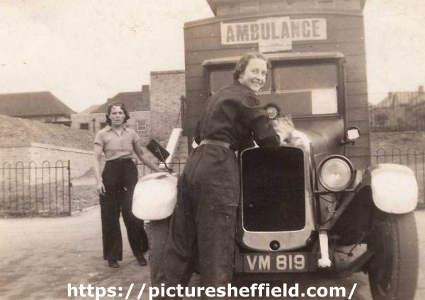 ARP ambulance with two female crew members at Hartley Brook School Depot, Sheffield, c. 1939
