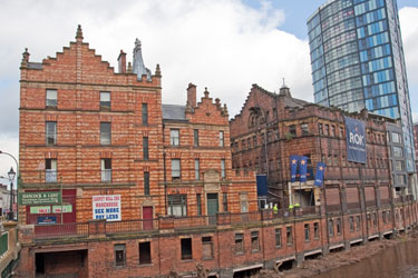 Royal Exchange Flats (left); Castle House; former Hancock and Lant Ltd. premises originally multi storey stables and IQuarter Apartments and Retail under construction, Blonk Street from Castlegate looking across the River Don