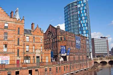 View East along River Don from Lady's Bridge towards Blonk Bridge showing Royal Exchange Flats; Castle House; former premises of Hancock and Lant Ltd. originally multi storey stables and IQuarter Apartments etc. and Park Inn (formerly Hot