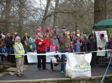 Group of people waiting for the beginning of the Charity Duck Race in Endcliffe Park on Easter Monday