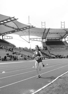 Hallamshire Harriers competitor in one of the 3000m races during the Festival of Athletics, Don Valley Stadium