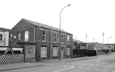 Newhall Road Bridge (left) and former Lodge Inn, No. 143 Newhall Road looking towards Attercliffe with the floodlights from Don Valley Stadium in the background
