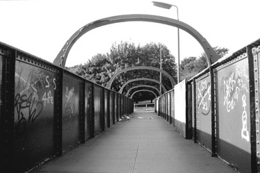 Footbridge connecting Station Lane and Holywell Road near near former Brightside Station looking towards Hollywell Road 	