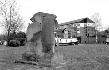 Heron and Fish Sculpture by Vega Bermejo Victoria Quays / Canal Basin, Sheffield and South Yorkshire Navigation with Basin Masters Office and Navigation House in the background