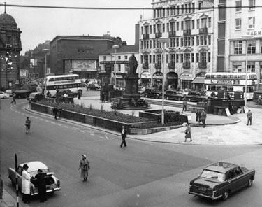Fitzalan Square looking towards (l. to r.) Odeon Cinema, Elephant Inn (corner of Norfolk Street), John Smith's Tadcaster Brewery Co. Ltd., offices, The White Building and Marples Hotel. King Edward VII Memorial, foreground