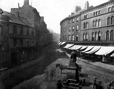 Ebenezer Elliott Monument, Market Place looking towards High Street. Shops on right include No. 49 Thos. Myers, jeweller, Nos. 51-53 Alfred Brookes, hosier and glover, No. 55 Robert Wm. Brookes, restaurant, George Hotel, left, (with five chimneys)