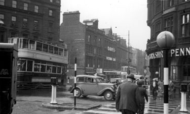 Fargate from Town Hall Square, Yorkshire Penny Bank, right, premises on left include Winchester House and No 40, Davy's Building, Victoria Cafe and Arthur Davy and Sons Ltd., provision merchants