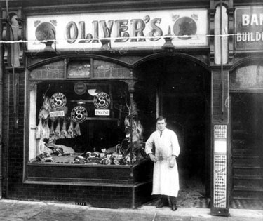 Alfred Oliver at the door of Oliver Brothers butchers shop, No. 14 Staniforth Road. (Arnold Callis, estate agent in Bank Buildings adjoining)