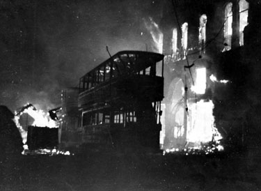 High Street, trams on fire outside the Bodega during the air raid
