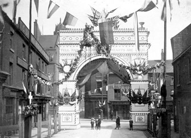 Queen Victoria's visit to Sheffield, decorative arch at junction of Broad Street and South Street, Park, photographed from South Street looking towards Broad Street, premises in background include Broad Street Cafe