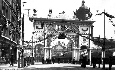 Queen Victoria's visit. Decorative arch in Pinstone Street, St. Paul's Church in background