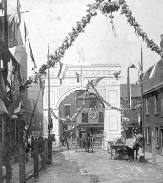 Queen Victoria's visit. Decorative arch at junction of Broad Street and South Street, Park, photographed from South Street looking towards Broad Street, premises in background include Broad Street Cafe
