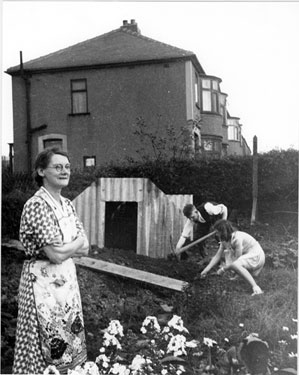 Kirk family installing an Anderson Shelter, No. 33 Firbeck Road