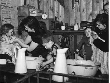 Ann's Road School Rest Centre, bath-time for blitzed children.