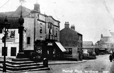 Woodhouse Market Cross and Woodhouse Picture Palace, built 1914, Market Square/Market Place. The cross was erected in 1775 by Joshua Littlewood. A sun dial and weather vane were added in 1826