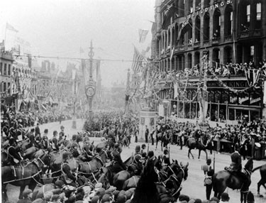 Royal visit of King Edward VII and Queen Alexandra, High Street, Foster's Buildings (including No. 8 Kingdon and Son, tobacconist, Nos. 10 - 16 W. Foster and Son, tailors) in background,