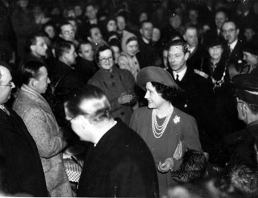 King George VI and Queen Elizabeth visit a community feeding station at the City Hall during the Blitz