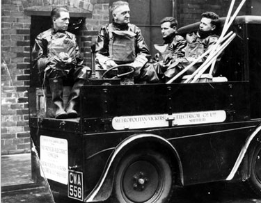 Workers with brooms and buckets, whose job it was to clean up after gas during World War II